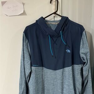 Zero friction golf performance jacket with kangaroo pocket